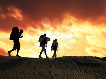 Royalty Free Photo of Hikers at Sunset in the Desert