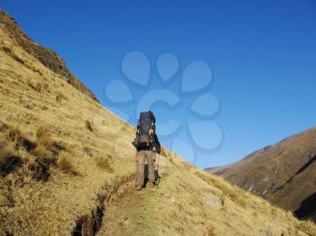 Royalty Free Photo of a Mountaineer on a Trail