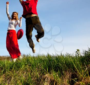 Royalty Free Photo of a Couple Jumping