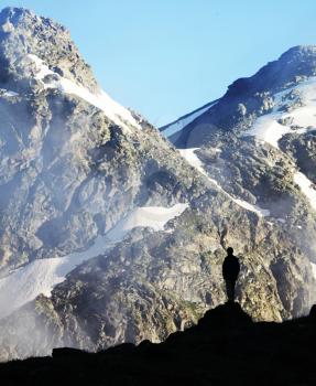 Royalty Free Photo of a Silhouette of a Man in the Mountains