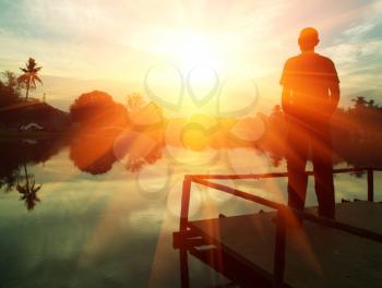 Royalty Free Photo of a Silhouette of a Man at Sunset