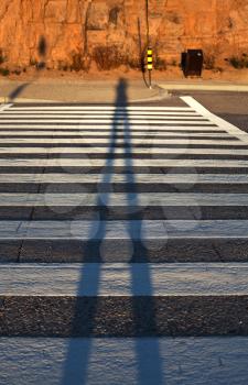 Royalty Free Photo of a Shadow on Painted Road Lines