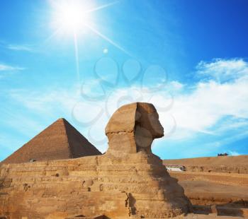 Royalty Free Photo of an Egyptian Sphinx and Pyramid