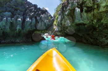 Kayak in the island lagoon between mountains. Kayaking journey in El Nido, Palawan, Philippines.