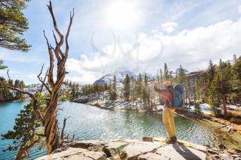 Man with hiking equipment walking in Sierra Nevada mountains, California, USA