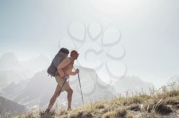 Wanderlust time. Man hiking in beautiful Fann mountains in Pamir, Tajikistan. Central Asia.