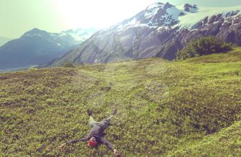 Relaxing backpacker  in mountains. Instagram filter.