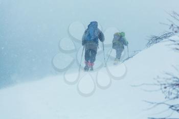 Hiker with snowshoes in winter