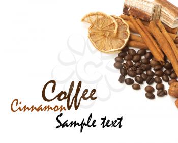 Coffee beans, cinnamon, lemon and sweets over white with a space for Your text