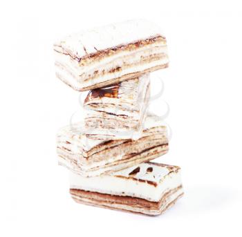 Few pieces of nougat stacked together on white