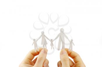 Paper family in hands isolated on white background