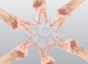 Hands of teamwork , forming the star shape