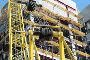 Building - the crane near the under construction  house. Taken from the bottom up