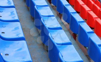 empty blue and red stadium seats