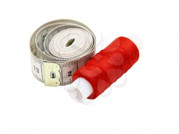 The coil of a red thread with centimeter on a white background