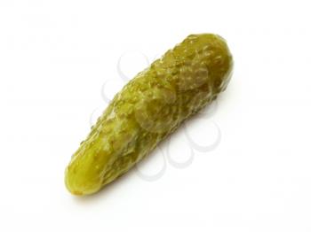 The green tasty pickle lies on a white background