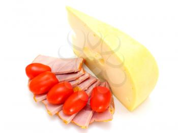 Cheese with holes and red tomatoes lie on a white background