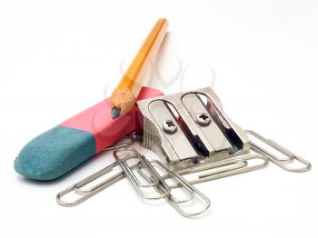 shot of eraser, pencil and pencil metal double sharpener on a white background