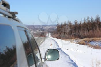 Car on winter road.