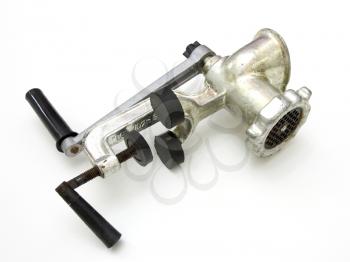 close up of meat grinder on white background