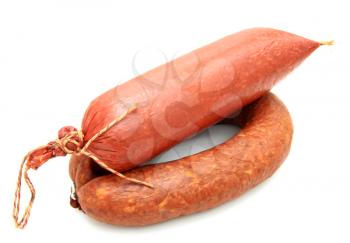 Tasty sausage is curtailed by a ring lies on a white background
