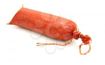 Tasty sausage is curtailed by a ring lies on a white background
