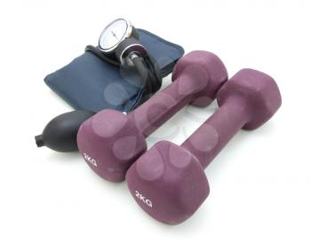 Stethoscope and dumbbell training weights together to conceptualize a healthy lifestyle.