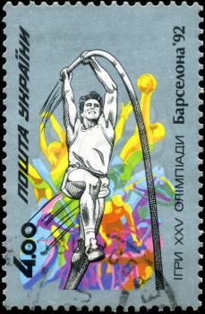 UKRAINE - CIRCA 1992: A stamp printed in Ukraine showing high jump with a pole, Olympic games in Barcelona, circa 1992