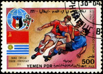 YEMEN - CIRCA 1990: stamp printed by Yemen, shows soccer players and ball, circa 1990.