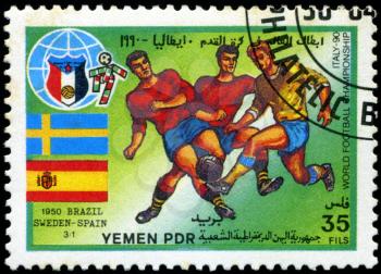 YEMEN - CIRCA 1990: stamp printed by Yemen, shows soccer players and ball, circa 1990.