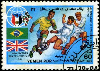 YEMEN - CIRCA 1990: stamp printed by Yemen, shows soccer players and ball, circa 1990.