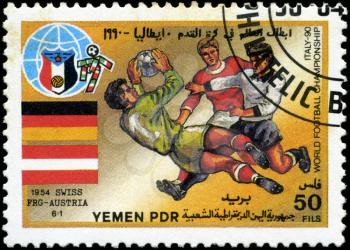 YEMEN - CIRCA 1990: stamp printed by Yemen, shows soccer players and ball, circa 1990.