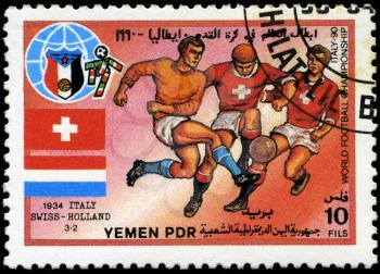 YEMEN - CIRCA 1990: stamp printed by Yemen, shows soccer players and ball, circa 1990.