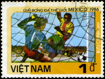 VIETNAM - CIRCA 1985: a stamp printed by VIETNAM shows football players. World football cup in Mexico 1986, circa 1985