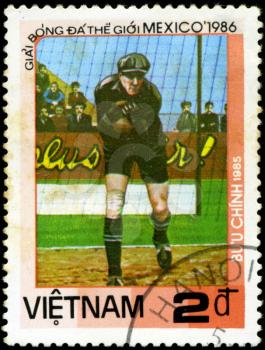 VIETNAM - CIRCA 1985: a stamp printed by VIETNAM shows football players. World football cup in Mexico 1986, circa 1985