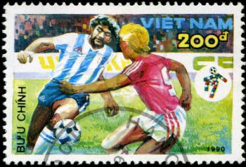 VIETNAM - CIRCA 1990: a stamp printed by Vietnam shows football players. World football cup in Italy, series, circa 1990