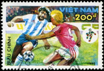 VIETNAM - CIRCA 1990: a stamp printed by Vietnam shows football players. World football cup in Italy, series, circa 1990