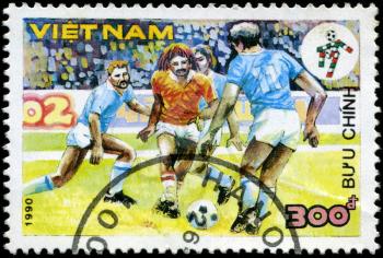 VIETNAM - CIRCA 1990: a stamp printed by Vietnam shows football players. World football cup in Italy, series, circa 1990