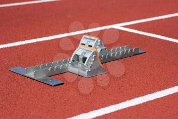 Athletics starting blocks on race track