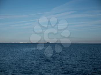 Cruise ship floating away on the waves of the sea.