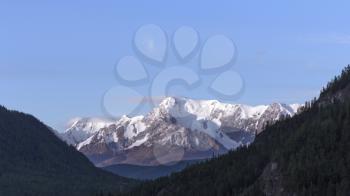 Beautiful winter landscape with snow covered mountain peaks.