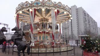 MOSCOW, RUSSIA, May 21, 2017: Children go in carousel and having fun on a cloudy day, Moscow. UltraHD stock footage.