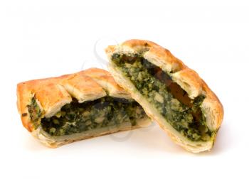 Puff pastry isolated on white background. Healthy pasty with spinach.