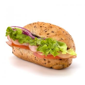 Big appetizing  fast food baguette sandwich with lettuce, tomato, smoked ham and cheese isolated on white background. Junk food subway.