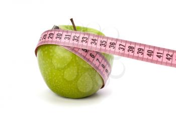 Apple with tape measure isolated on white background. Healthy lifestyle concept.