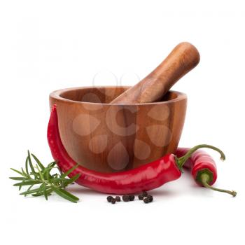 fresh flavoring herbs and spices in wooden mortar isolated on white background