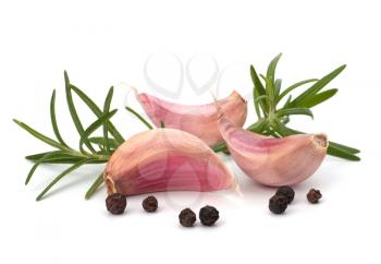 Garlic clove and rosemary leaf  isolated on white background