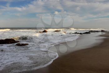 Picture of Beachfront with Rocks and Blue Skies