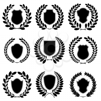 Set of heraldic black emblems on the white background