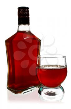 alcohol drink is in a bottle and glass isolated on white background